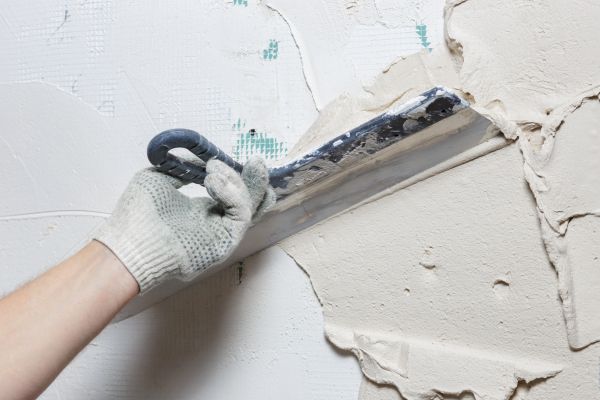 Man Installing Stucco on Wall